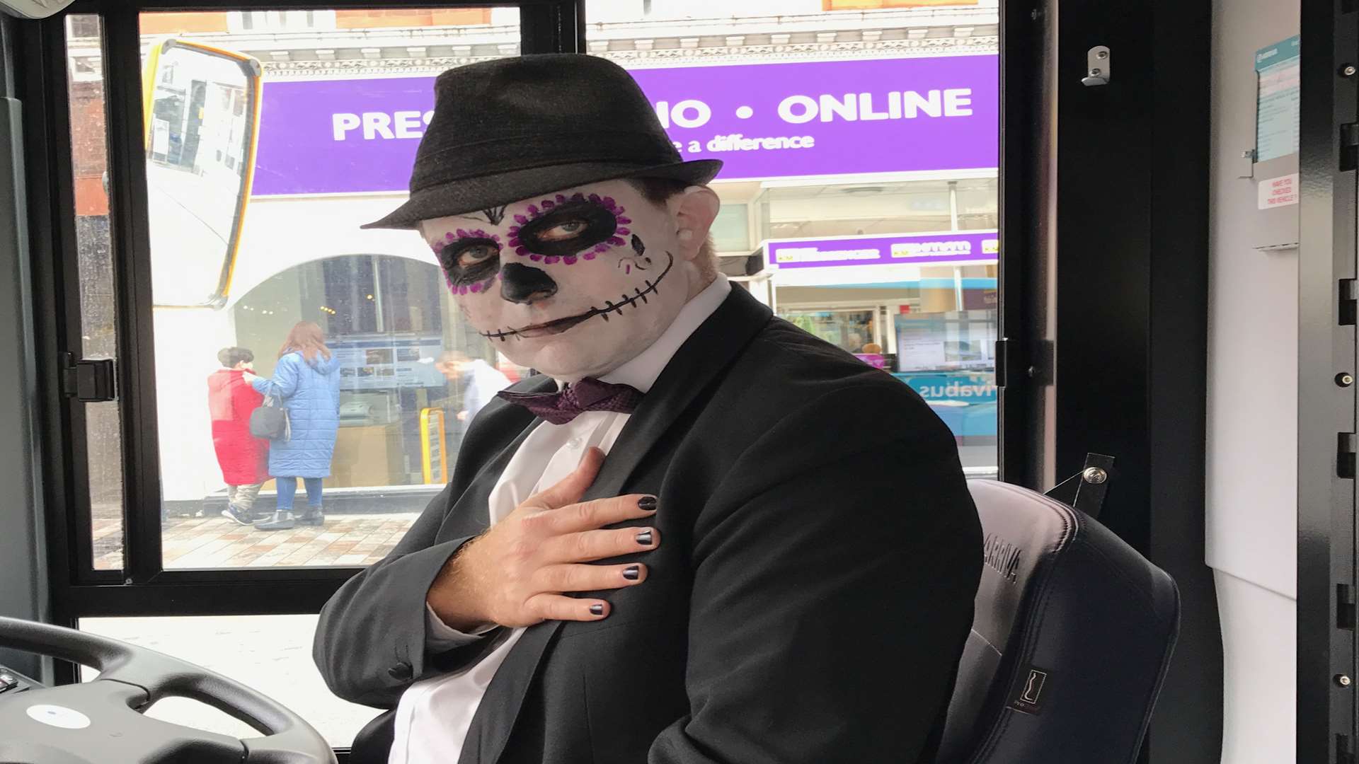This bus driver has dressed up for Halloween.