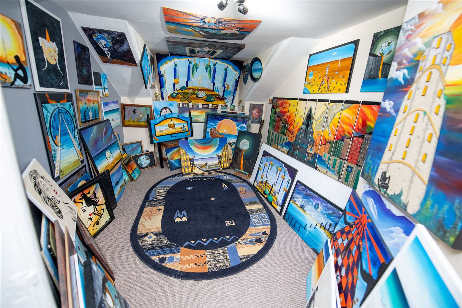 Artist Carl Stafford shows off his incredible house – a few doors down from where Van Gogh once lived. Picture: SWNS