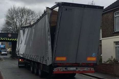 The lorry was damaged after it hit the bridge. Picture: Richard Law