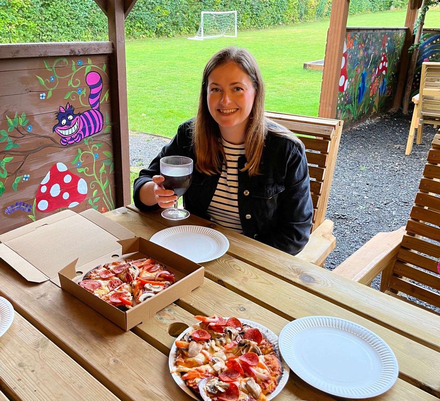 Enjoying our tasty but slightly charred pizzas, fresh from the wood-fired oven