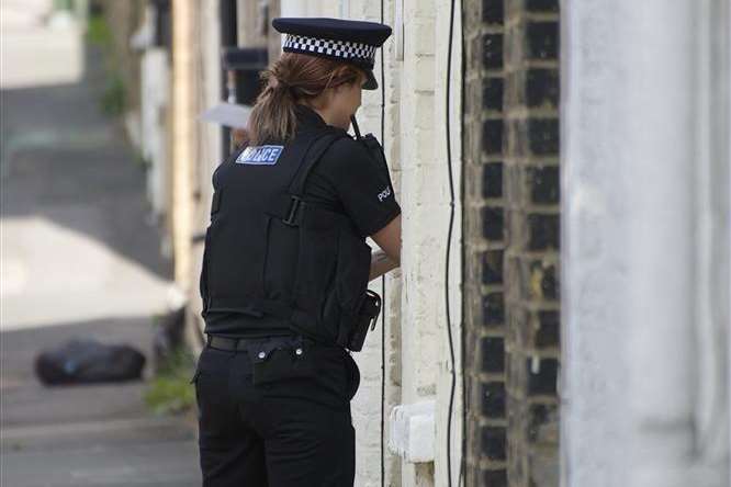 Officers conduct house to house enquiries in Roach Street, Strood.