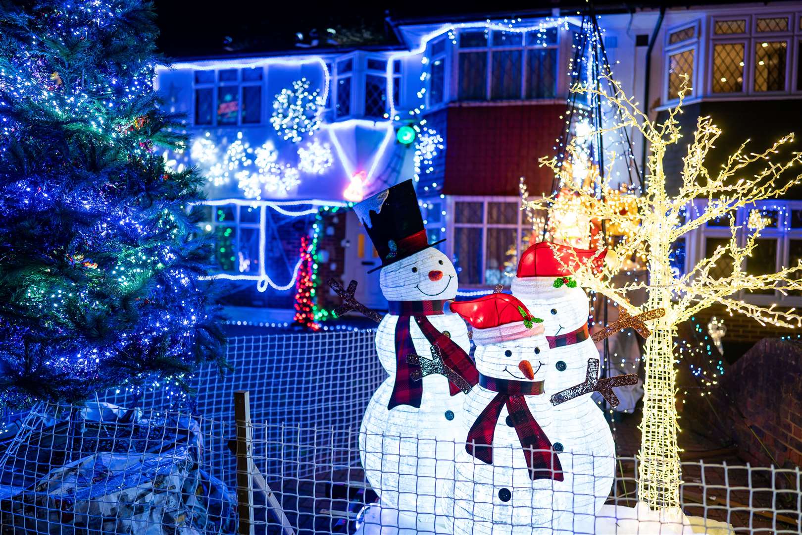 Houses illuminated by Christmas lights on Lower Morden Lane in Morden, south London (Aaron Chown/PA)
