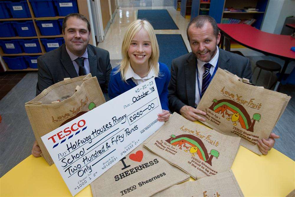 Nicole with store manager Stuart Finch and headteacher Ryan Driver