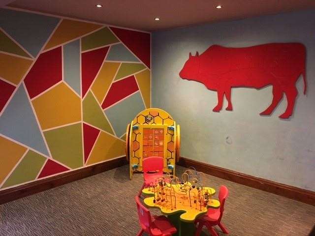 I’m not sure what the relevance was of the large red cow on the wall of the children’s play area but it remained toddler-free during our visit