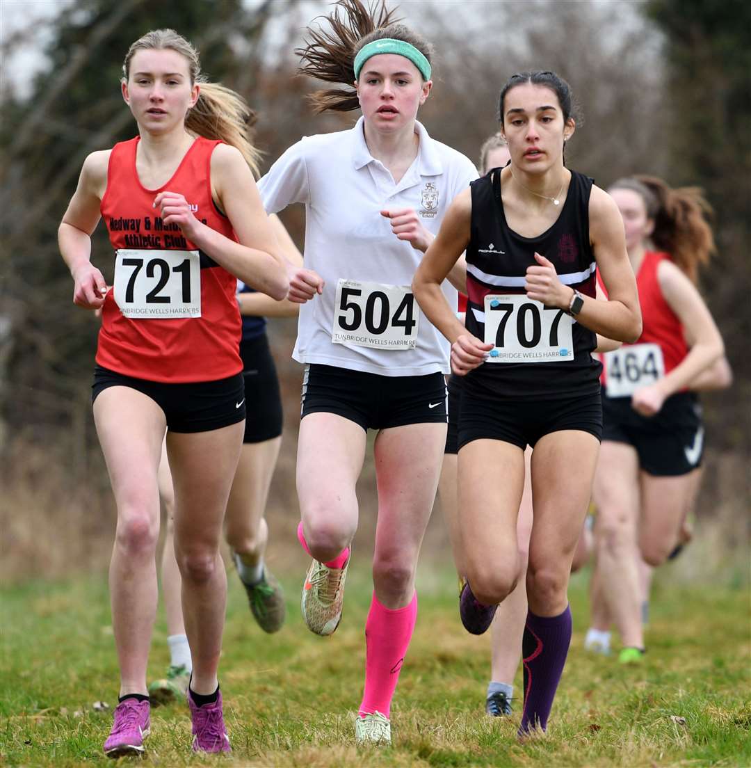Maidstone's Anna Palmer (No.721), Lily Slack (No.504) of Tunbridge Wells District and Hannah Clark (No.707) of Bromley in the senior girls' race. Picture: Barry Goodwin (54437950)
