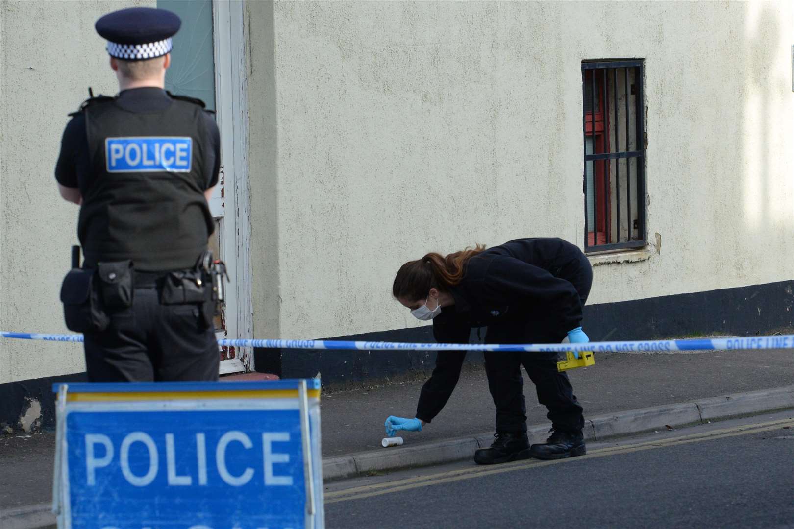 A forensic officer at work in Lock Street, Gillingham. Picture: Chris Davey