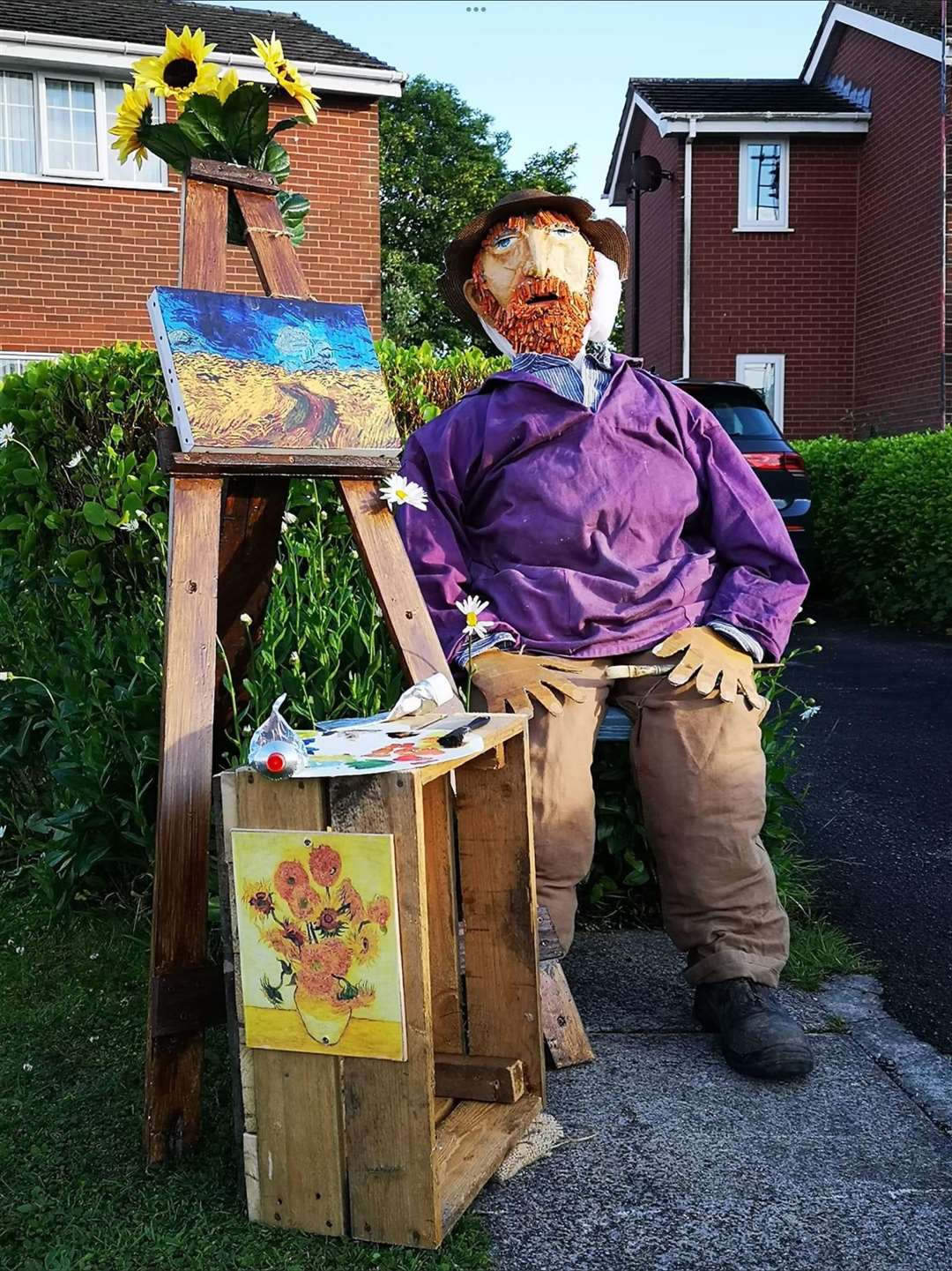 “A scarecrow figure of Vincent Van Gogh with his easel and table (Louise Henson/PA)