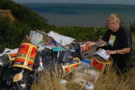 Angela Walder with rubbish fly-tipped at the cliffs in Oak Road, Minster.