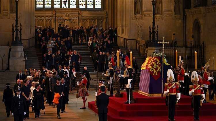 Members of the public pay their respects as the vigil begins around the coffin of Queen Elizabeth II. Picture: Ben Stansall/PA