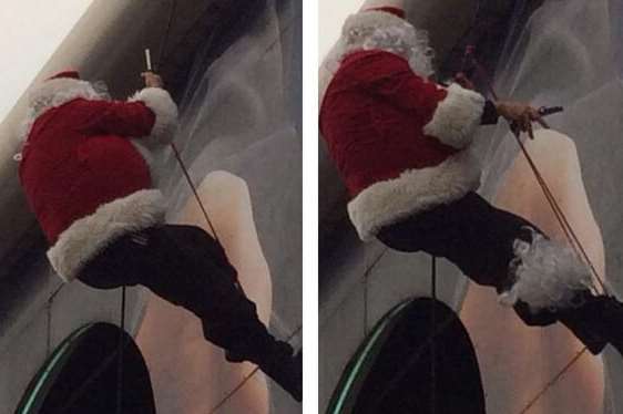The horrifying moment Santa begins to cut off his beard while stuck abseiling. Picture: Lea Swain @losmofo