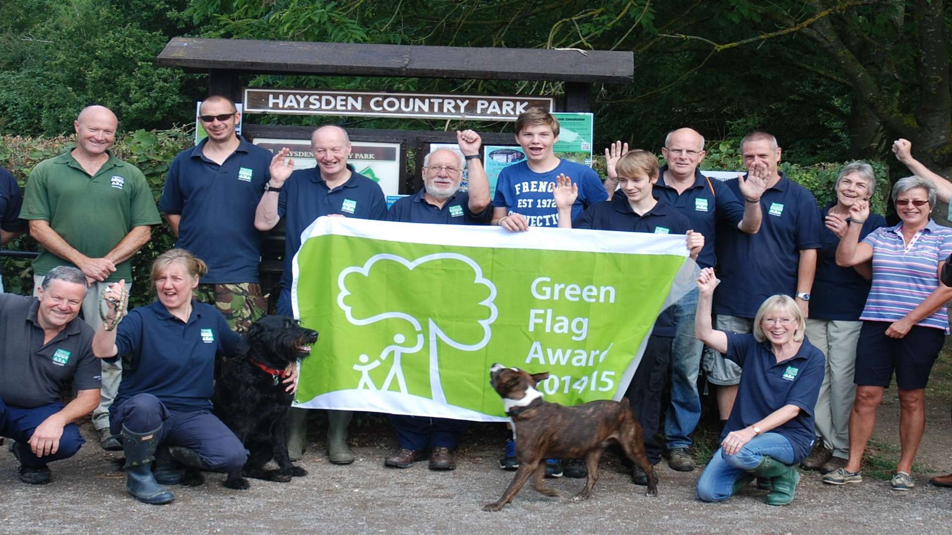 The Green Flag is displayed with pride at Haysden Country Park by: Volunteers, Tonbridge and Malling officers and, far right Borough Councillors Peter Bolt and David Cure