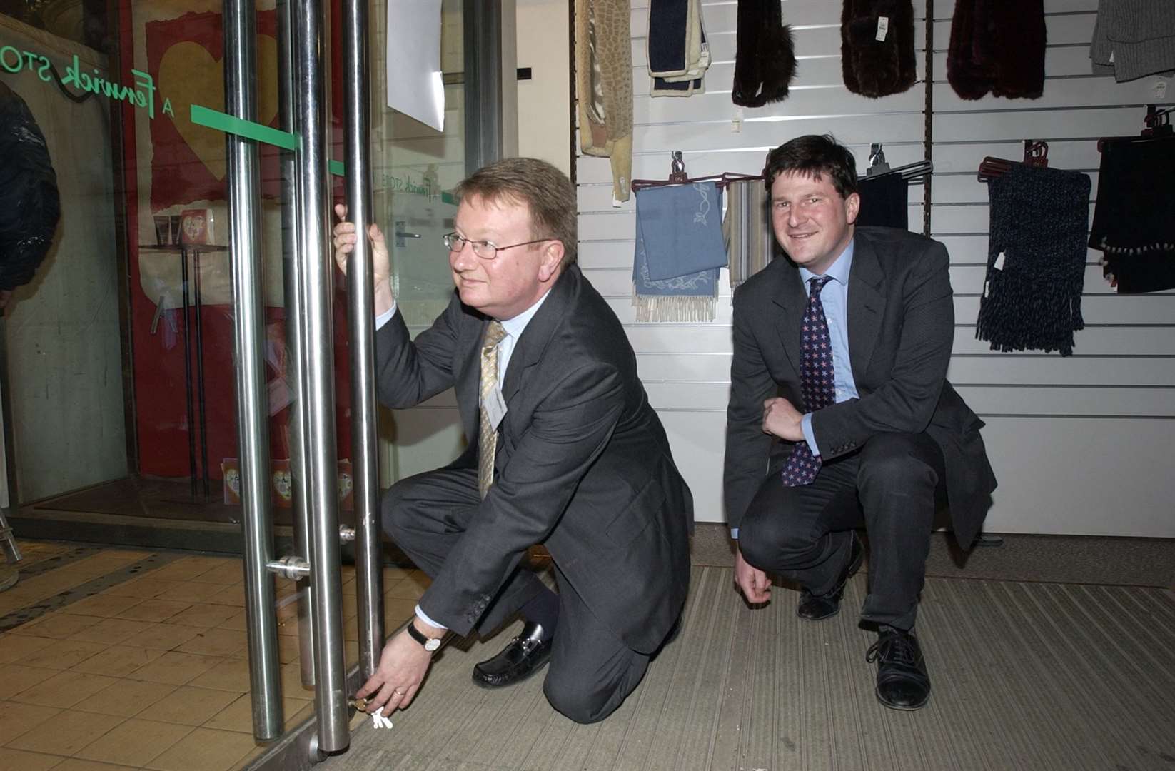 Ricemans store director Adam Bateman locks the door for the last time along with Hugo Fenwick