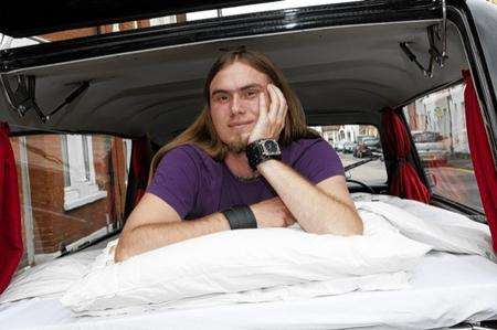 John Lastauskas sleeps in his hearse after a late night