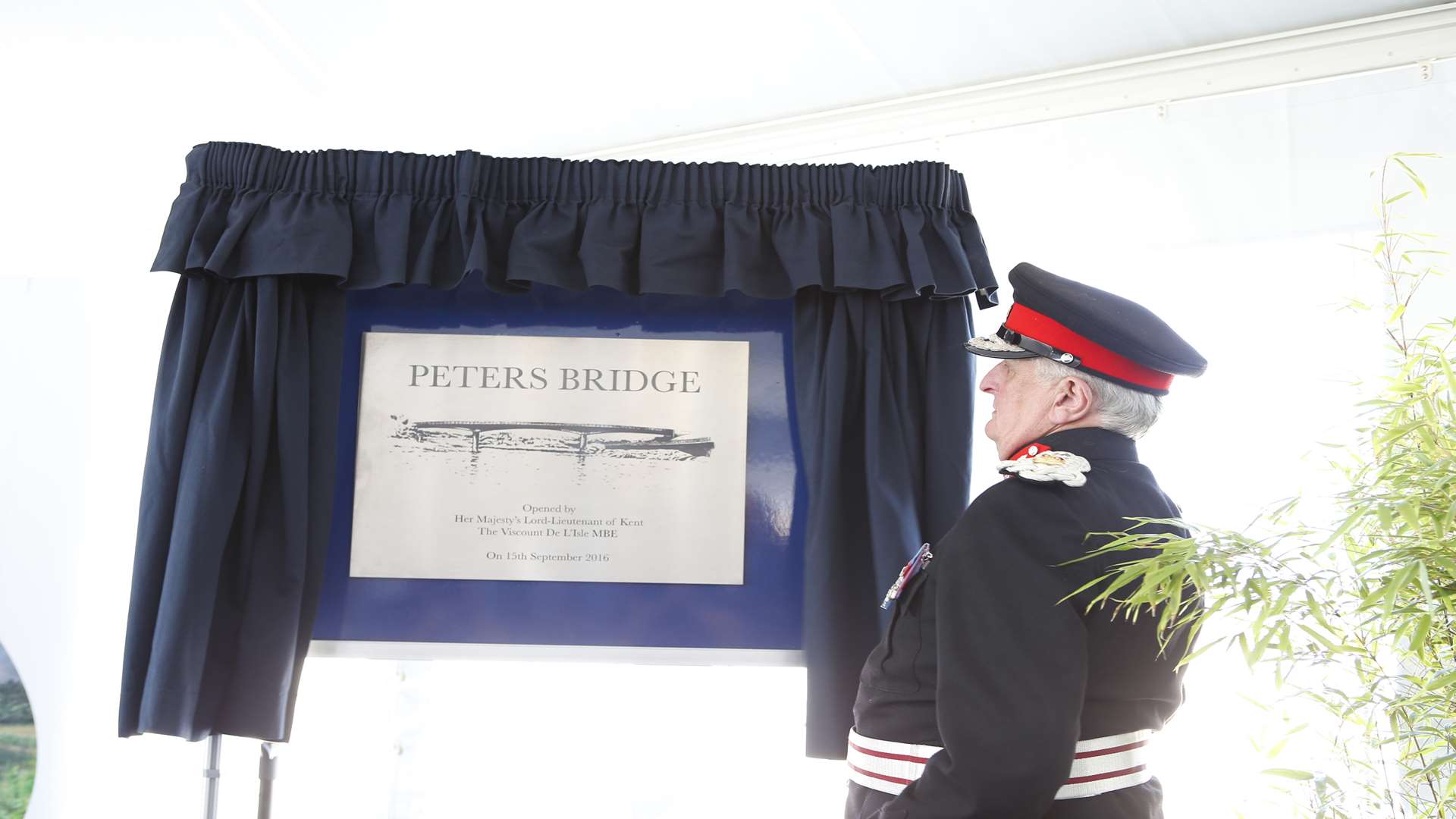 The Lord Lieutenant of Kent unveils a plaque at the opening of the bridge