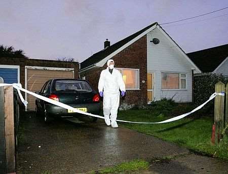 A forensic investigator at the scene in Greatstone