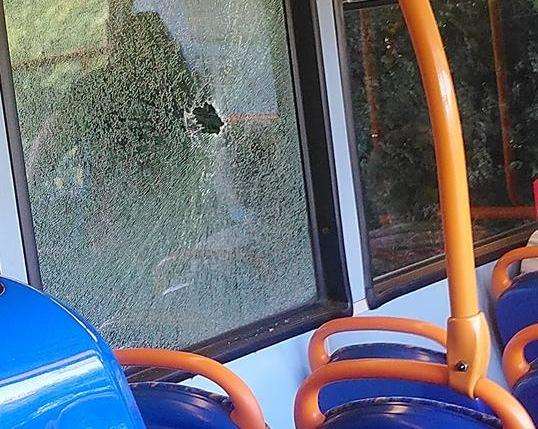 A rock was hurled through a bus window as it neared Shadoxhurst