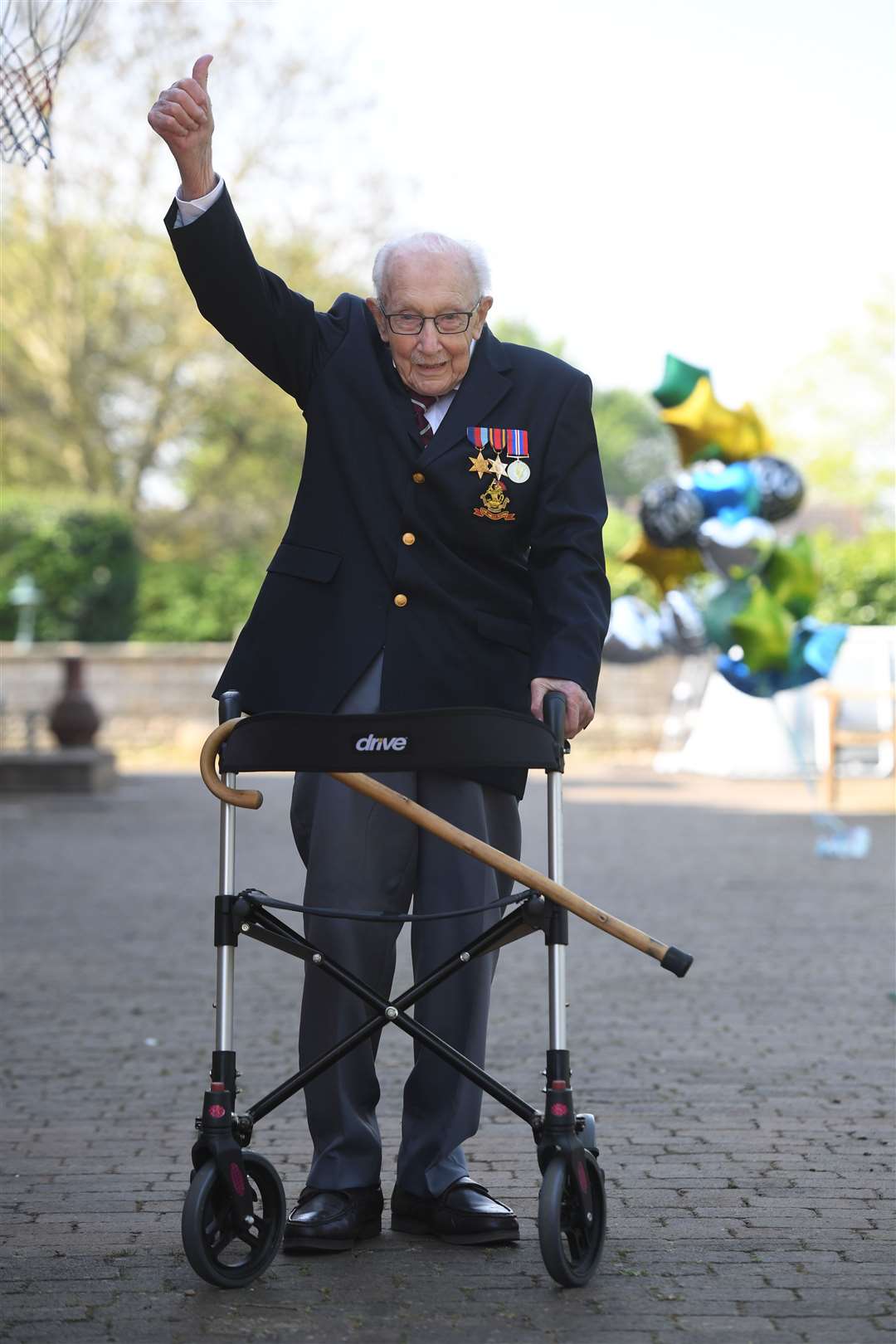 Captain Sir Tom Moore, then 99, at his home in Marston Moretaine, Bedfordshire, as he achieved his goal of 100 laps of his garden before his 100th birthday. He became a national hero after raising more than £32 million for NHS charities (Joe Giddens/PA)