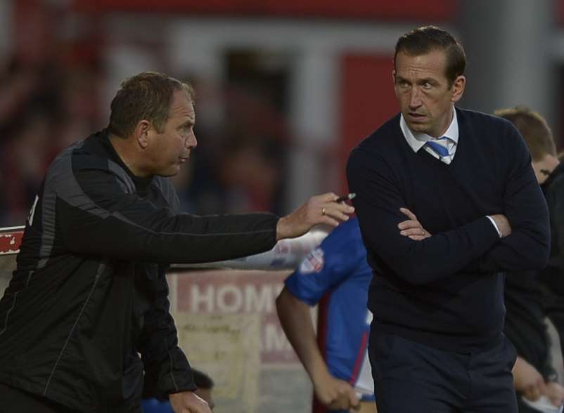 Gills boss Justin Edinburgh with coach Steve Lovell at Stevenage on Saturday. Picture: Barry Goodwin