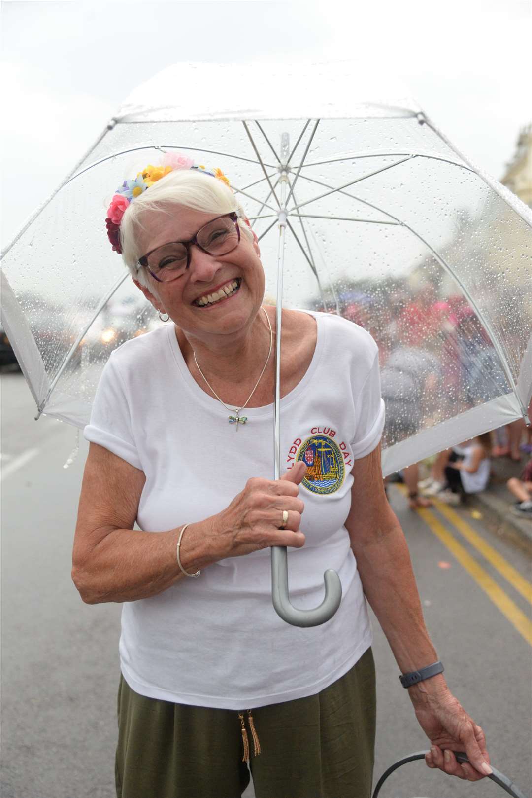 The rain did not dampen spirits for this volunteer collector, but there was a worrying shortage of donations in all of the collection buckets this year