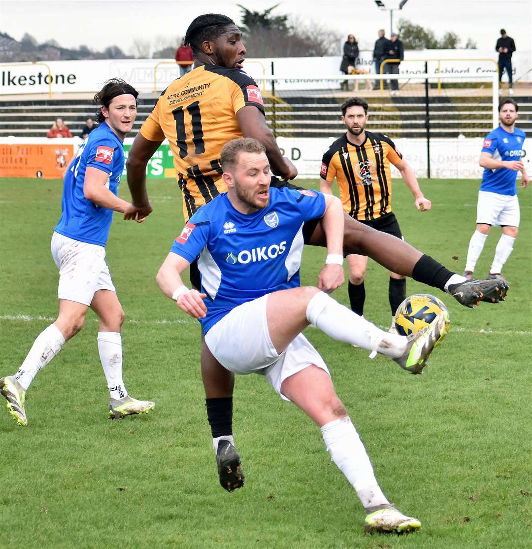 Folkestone's Seidou Sanogo in the thick of the action against Canvey Island during a 1-0 weekend win for Invicta. Picture: Randolph File