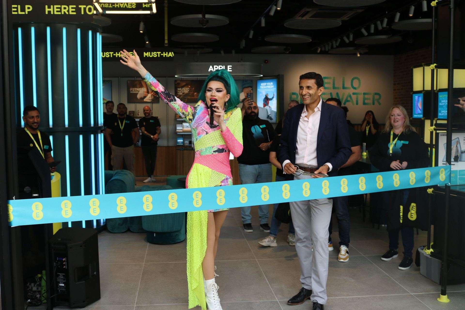 Ru Paul Drag Race UK sat, River Medway, and Asif Aziz OBE, Retail Director at EE cutting the new EE Store ribbon. Picture: EE