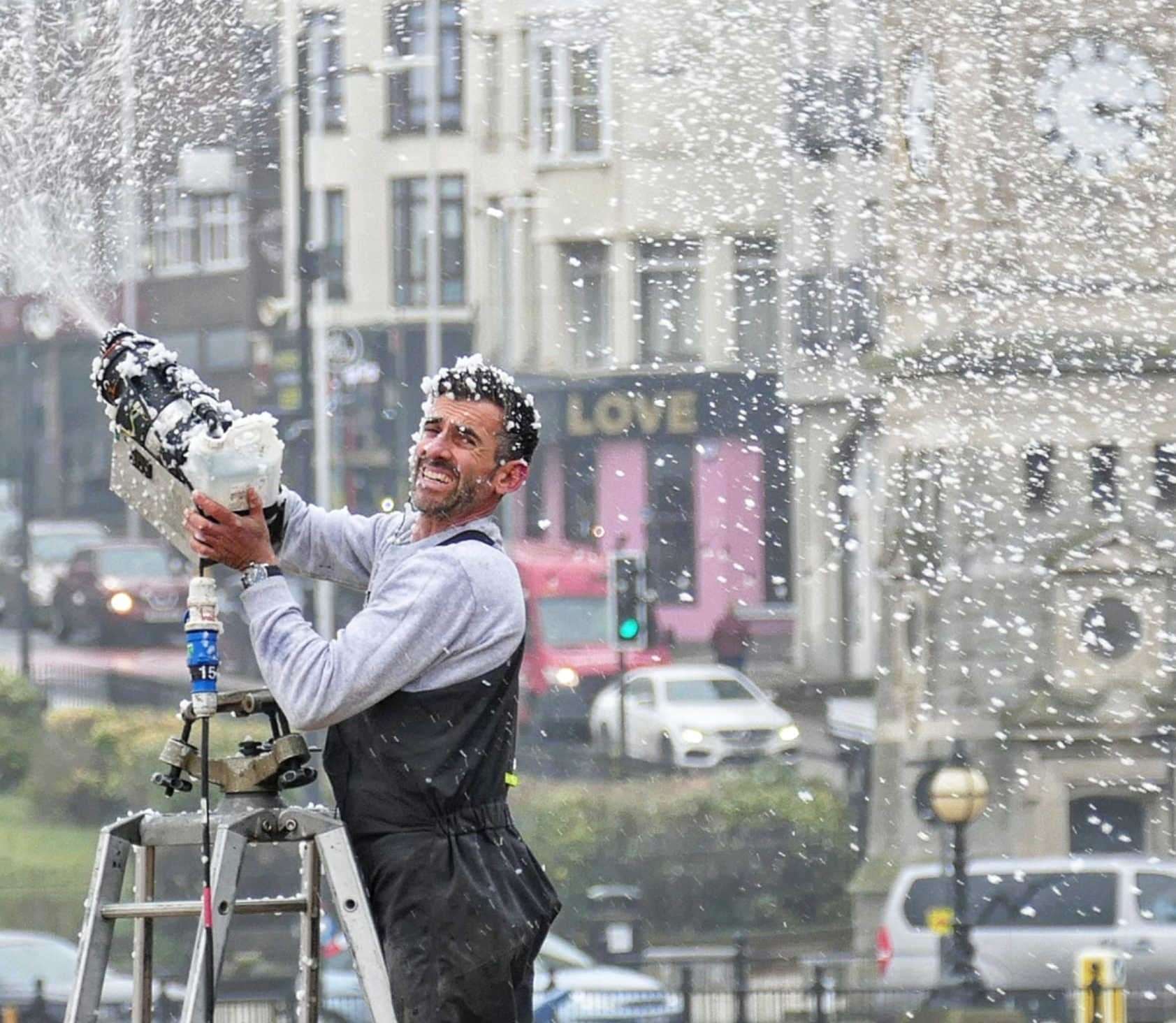 A crew hand operates a snow machine on Margate seafront Pic: Frank Leppard