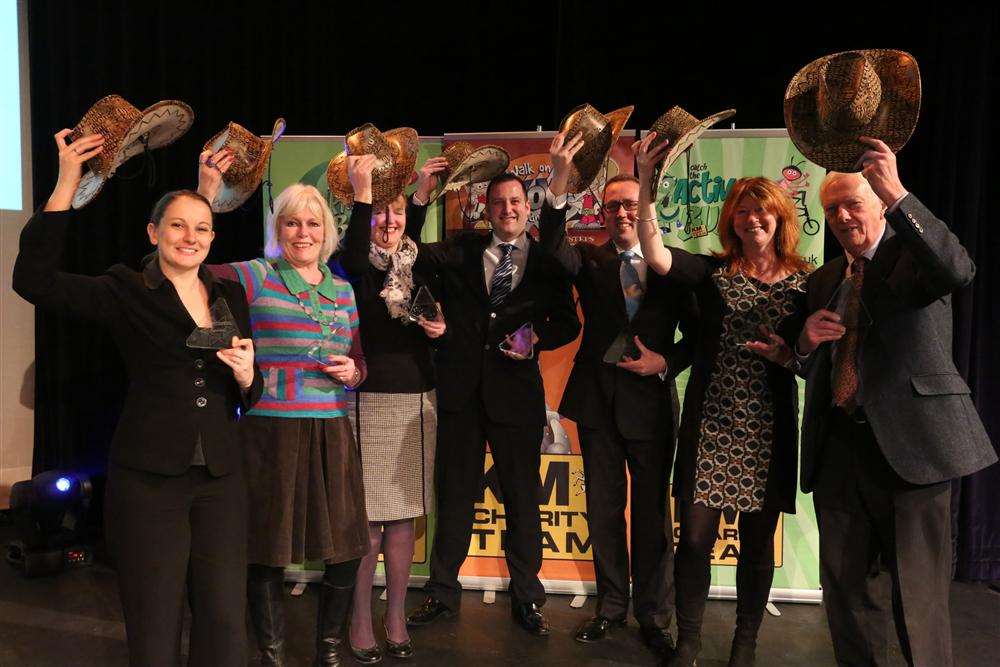 The Magnificent Seven: From left: Three R's Teacher Recruitment's Amy Woods, Orbit's Karen Campbell, Babybel's Elizabeth Carr, Specsavers' Matt Trusty, Countrystyle's Stuart Butler-Gallie, Southern Water's Beverley Thompson and Golding Homes represented by KM Charity Team trustee, Cllr Martin Vye The KM Walk to School Awards. The Gulbenkian Theatre, University of Kent campus, St Thomas Hill, Canterbury