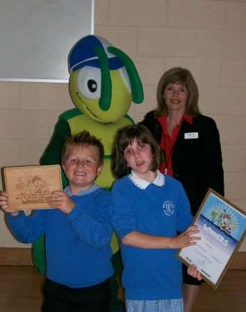 he KM Walking Bug and main sponsor Julia SmithÊ from HSBC presents the KM Green Footsteps trophy toÊNeptune Class of Brunswick House Primary School, Maidstone.Ê The class won the award for the highest number of walkers in the Maidstone District with 29 out of 29 children walking to school on the challenge day