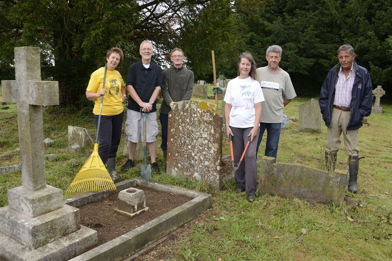 Members of the Hothfield History Society stand by the mysterious headstone. Pictured is Sharon Butler, Richard Hull, Nick Wheat, Sheila Flynn, Chris Rogers and Martin Crompton