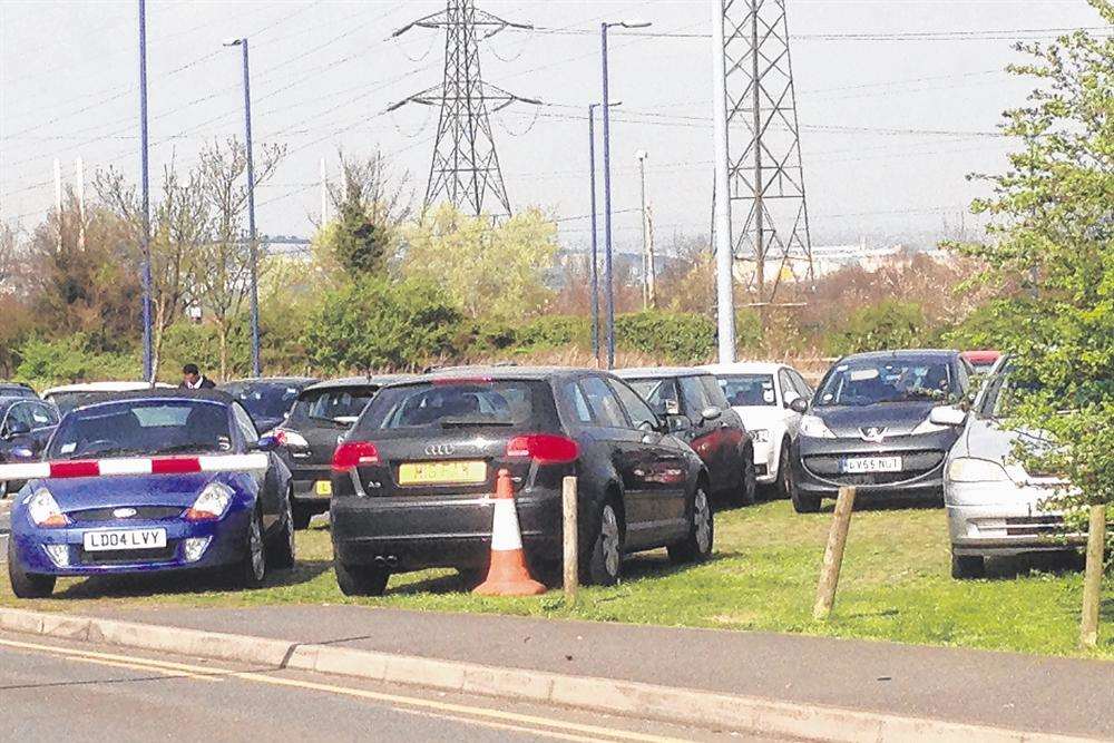 Cars having to park on grass verges at Darent Valley Hospital