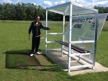 Groundsman John Osmond next to Leysdown FC's damaged dugout.