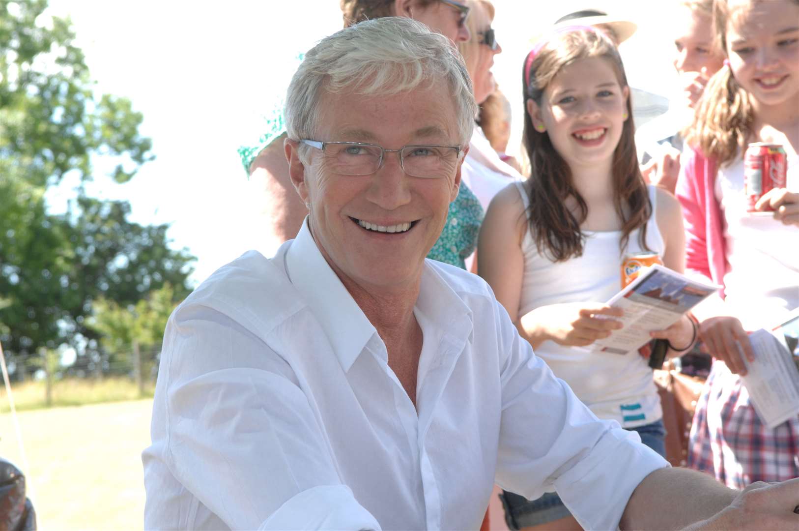 Paul O'Grady signing autographs at Aldington Primary School Fete. Picture: Gary Browne