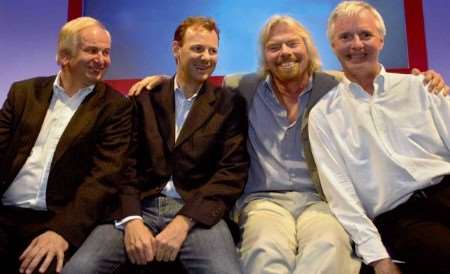 Peter Cullum, executive chairman, of Towergate, seated far left, with other winners and Sir Richard Branson, at Branson’s Oxfordshire home
