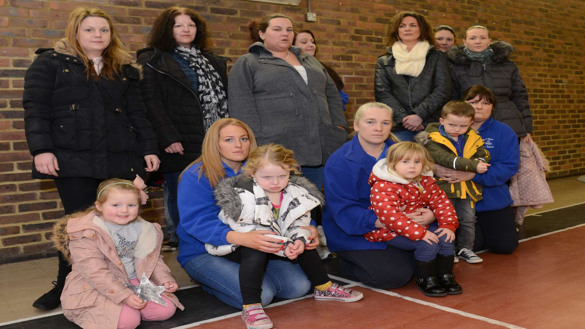Lisa Marchant with staff and some of the mum's and children at Busy Bees Nursery school.