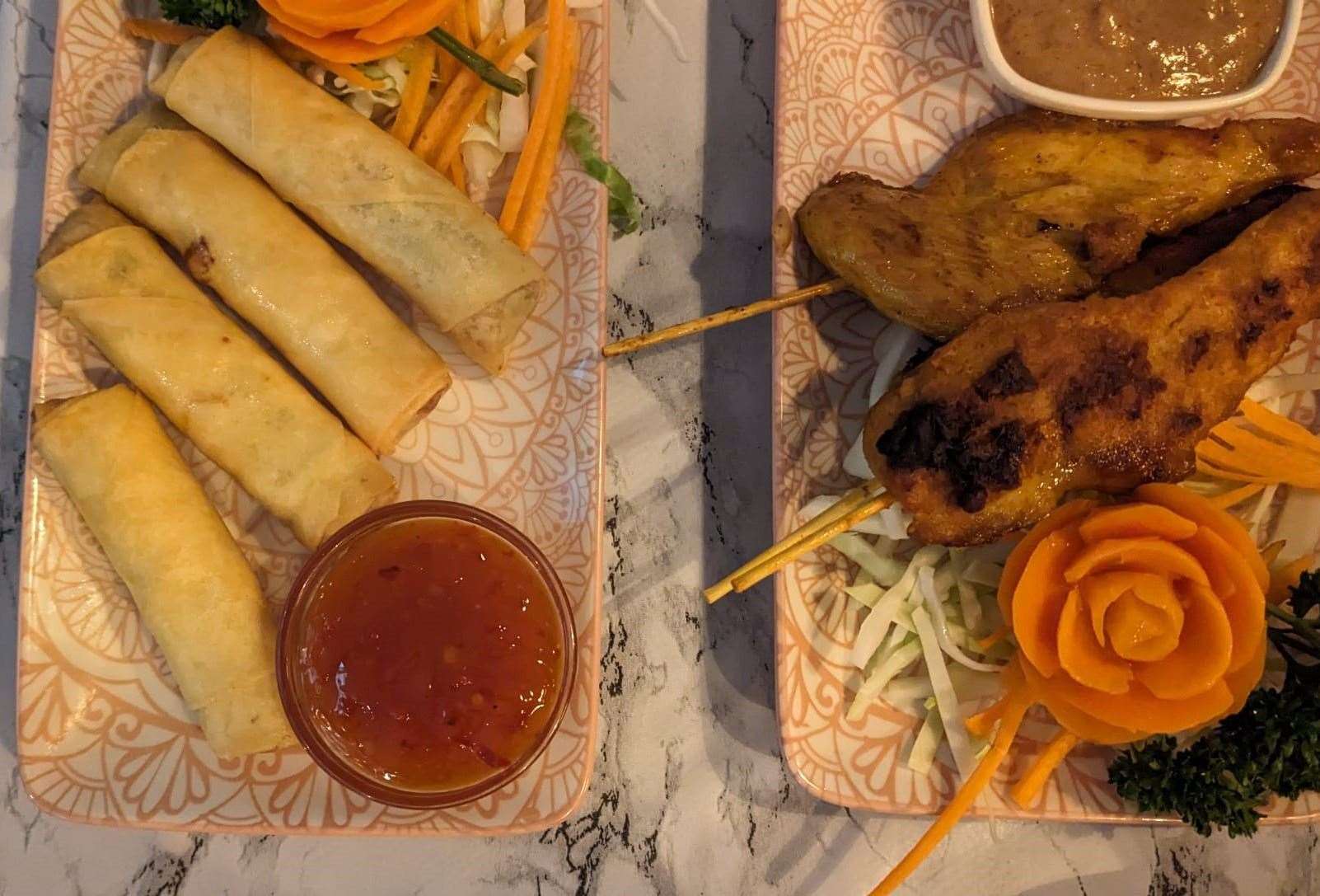 Crispy spring rolls and chicken satay skewers are a pair of classic starters