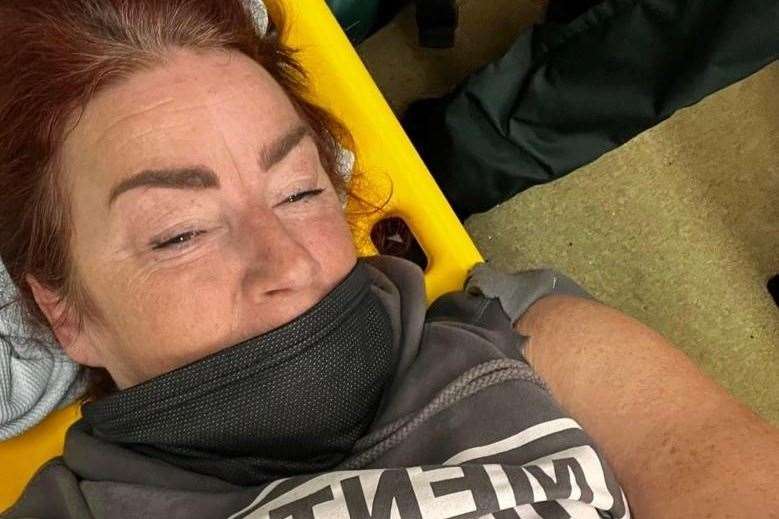Anthea McCarten on a stretcher after her accident