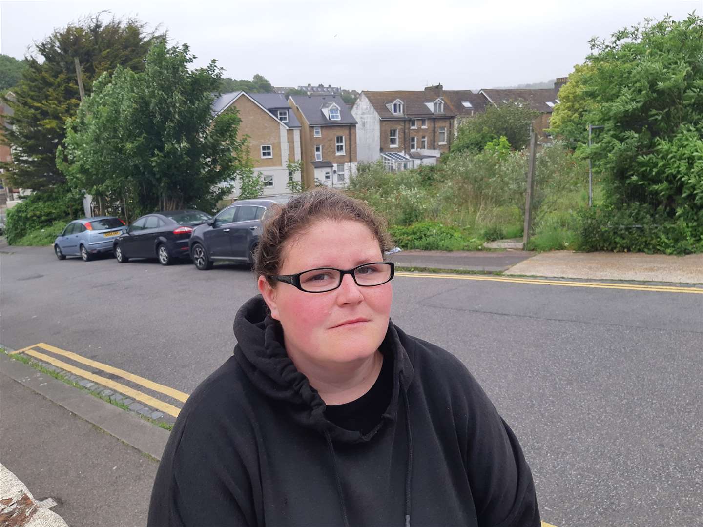 Hailey Drake with the planned flats site behind her. Picture: Sam Lennon KMG