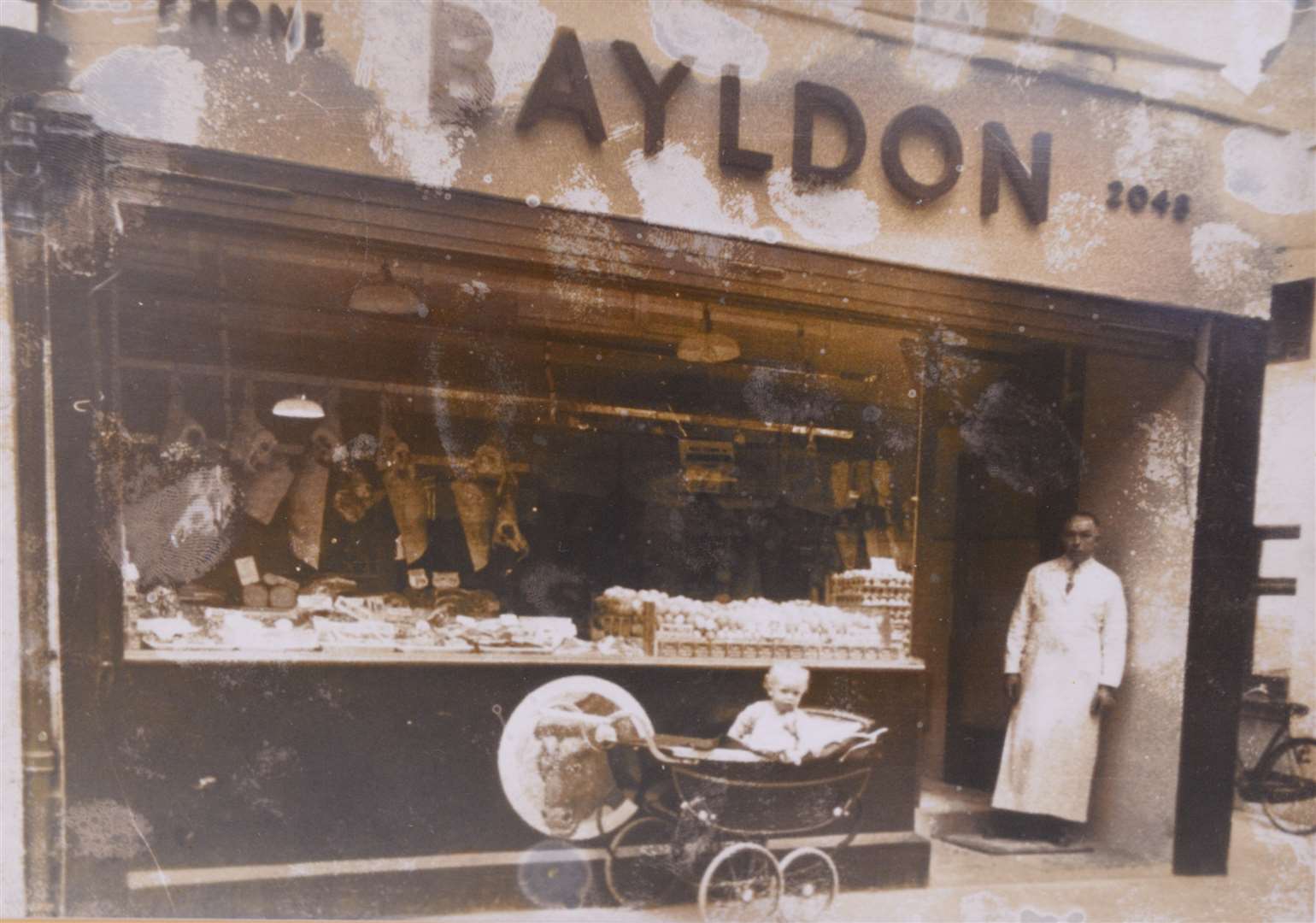 George Bayldon outside the shop in 1950