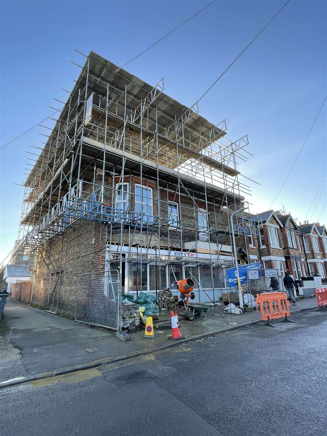 The building clad in scaffolding while the work was underway
