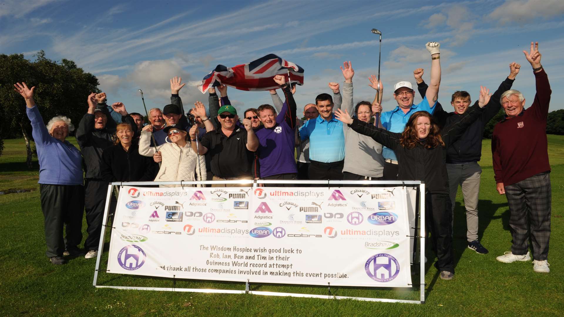The team, volunteers and supporters celebrate their success