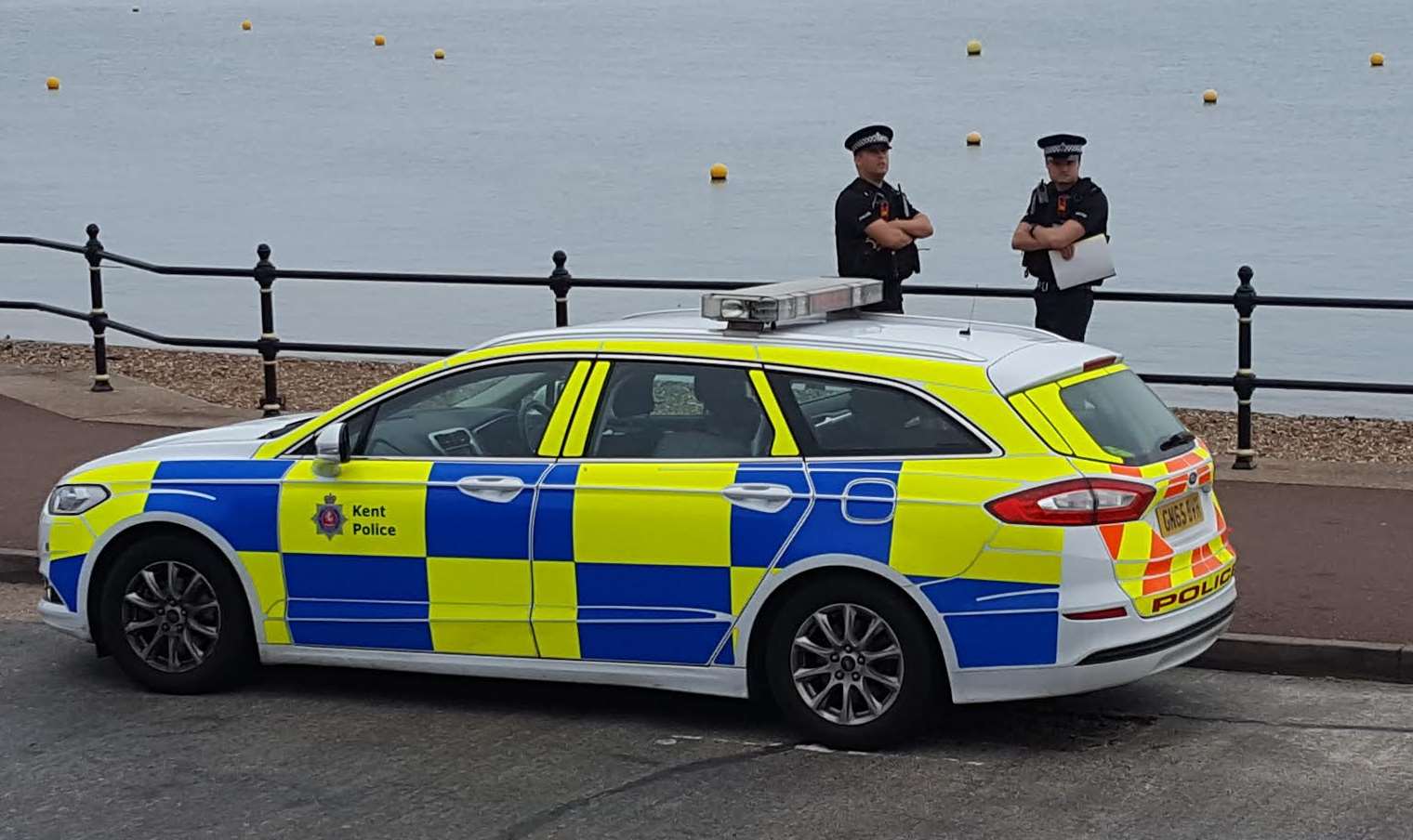 Police close to the spot where a body was found at Herne Bay beach.