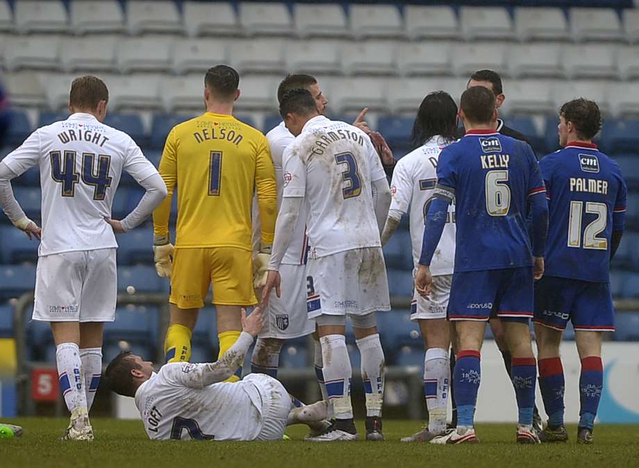 Gills skipper Doug Loft is injured in the match against Oldham Picture: Barry Goodwin