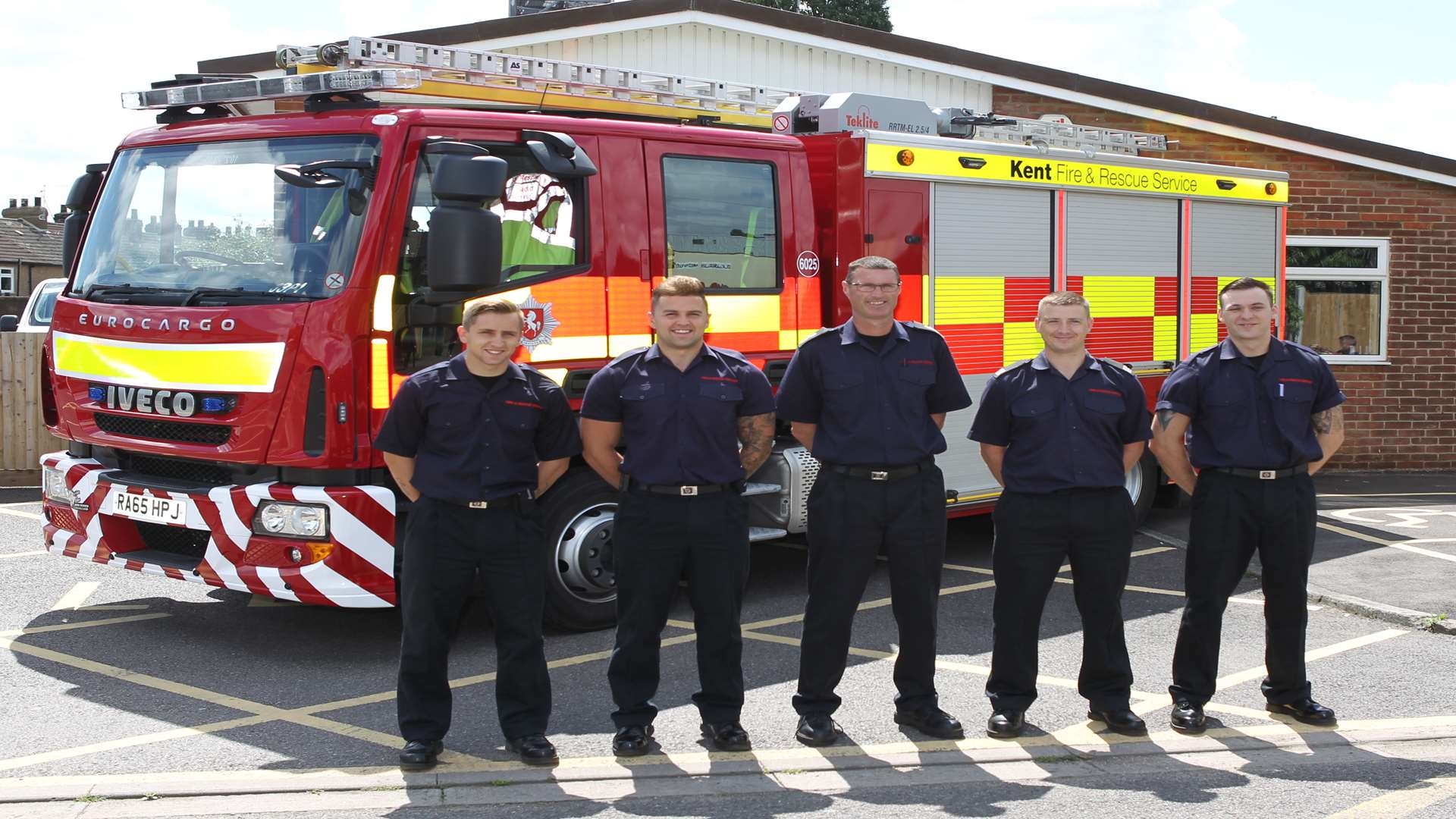 Watch Manager John Allwright, centre, with his team of firefighters with their new slimmer and smaller fire engine at their Swanscombe Station.