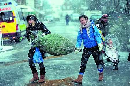 Christmas shoppers brave the snow