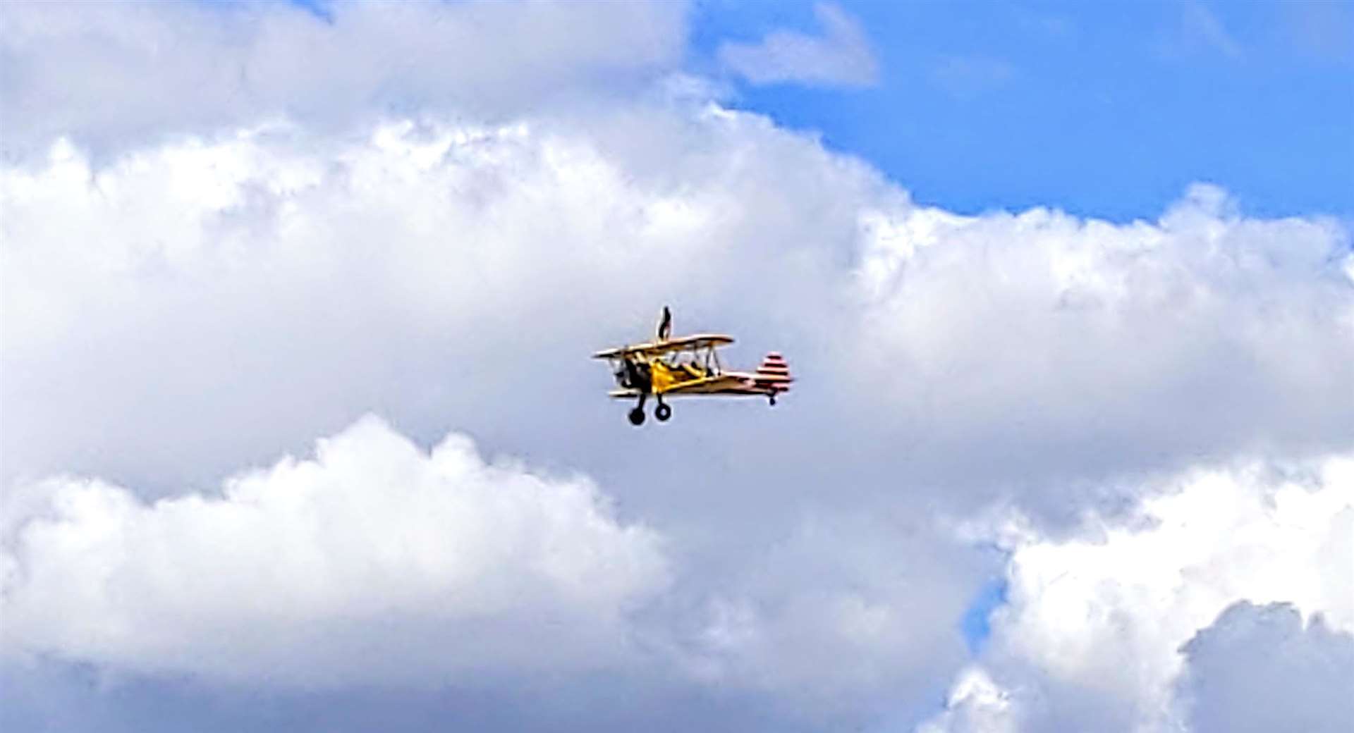 Reaching heights of 500ft, Nicky Clifford on top the Boeing Stearman biplane