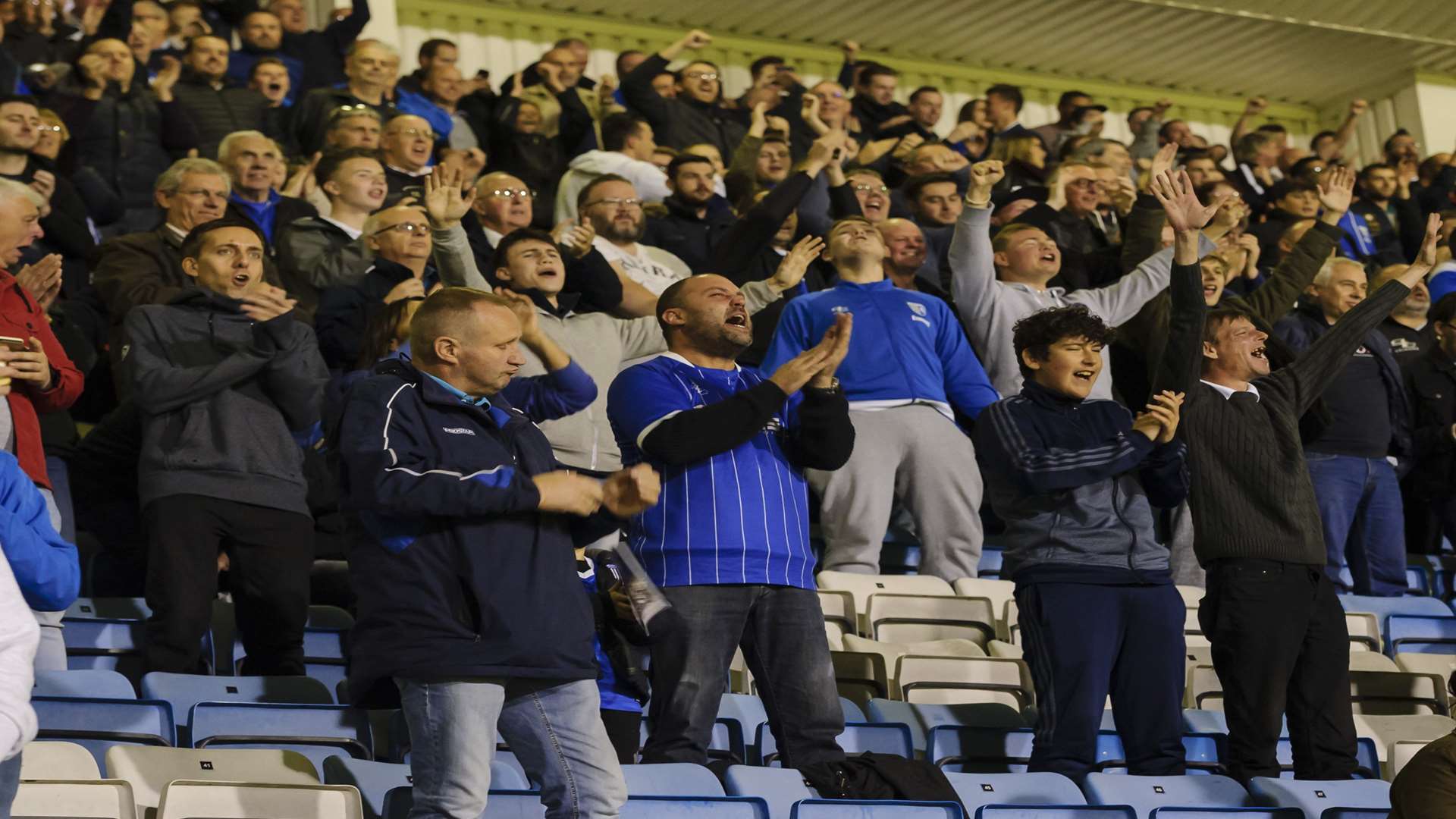 Fans celebrate a Gills goal from Tom Eaves Picture: Andy Payton