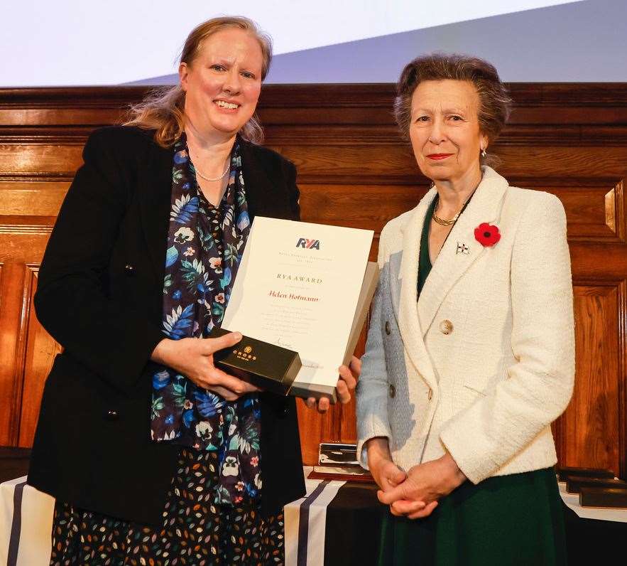 Helen Hofmann receives her award from The Princess Royal. Hofmann helped set up The Dover Boat Shed, which encourages vulnerable adults to meet on a boat to offer mutual support. Picture: Paul Wyeth RYA