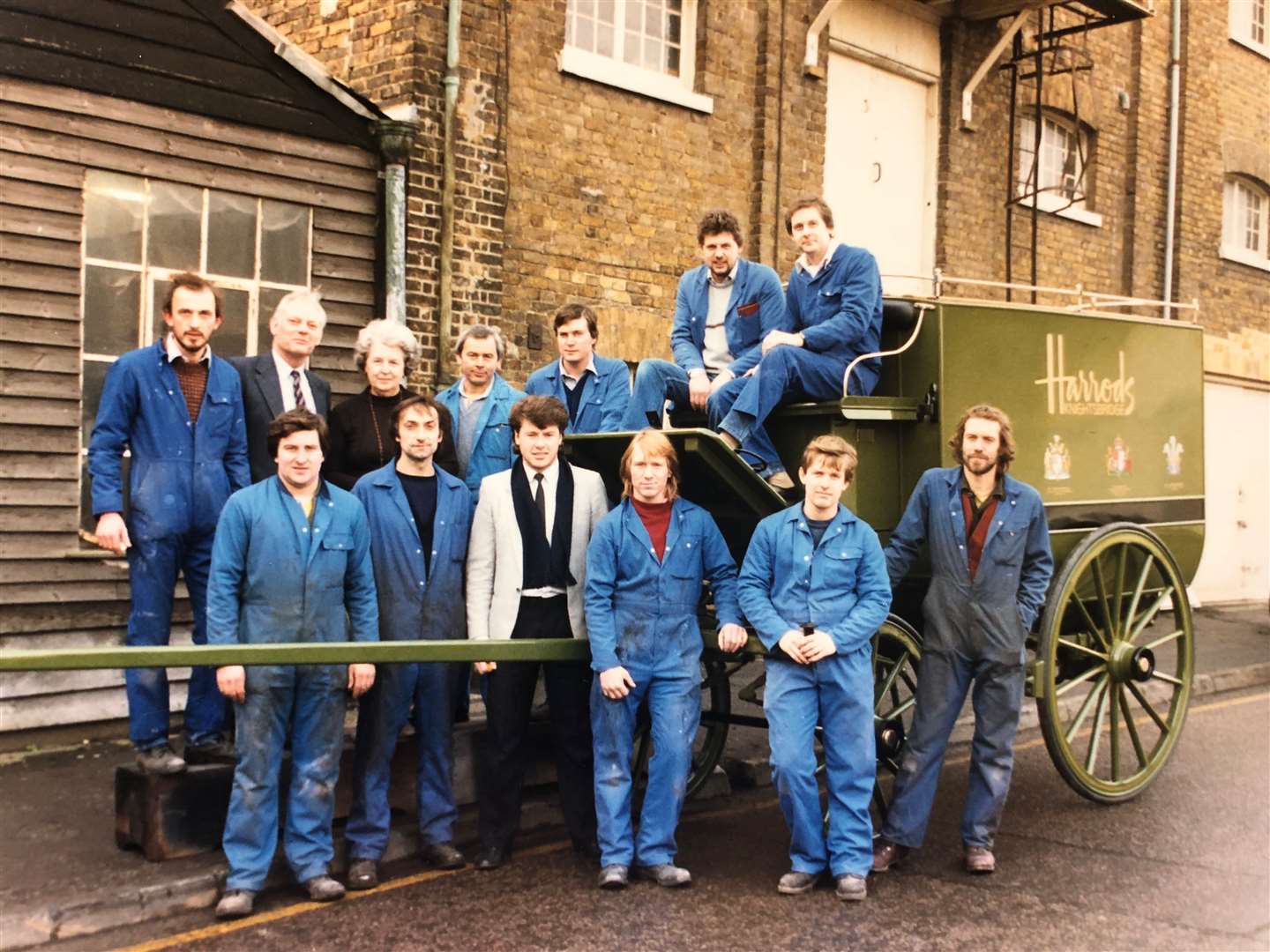 Coachbuilders from Ashford firm Croford stand alongside a restored carriage in previous times