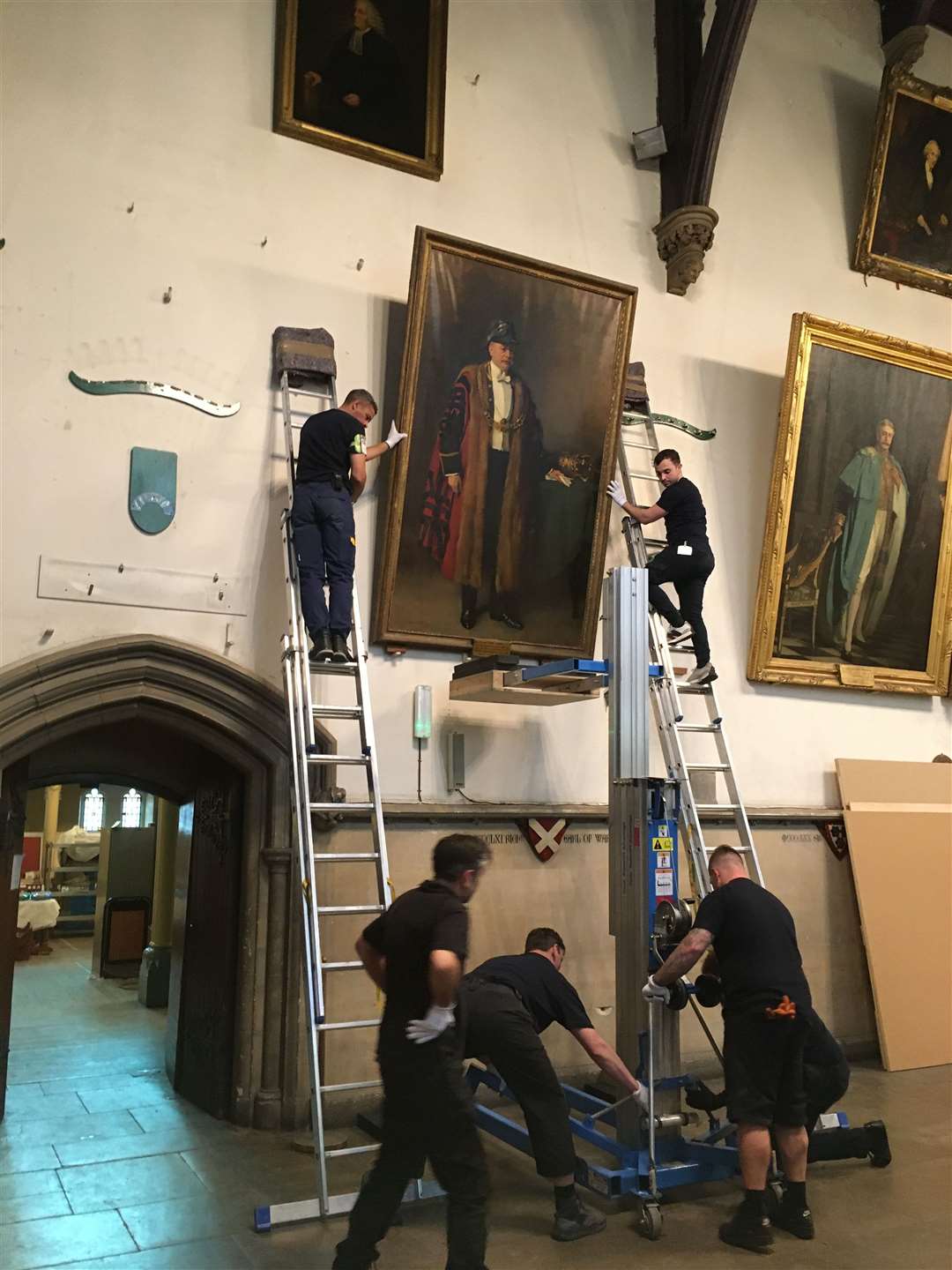 Preparation to take down a portrait for the renovation of Dover Town Hall. Picture: Dover District Council