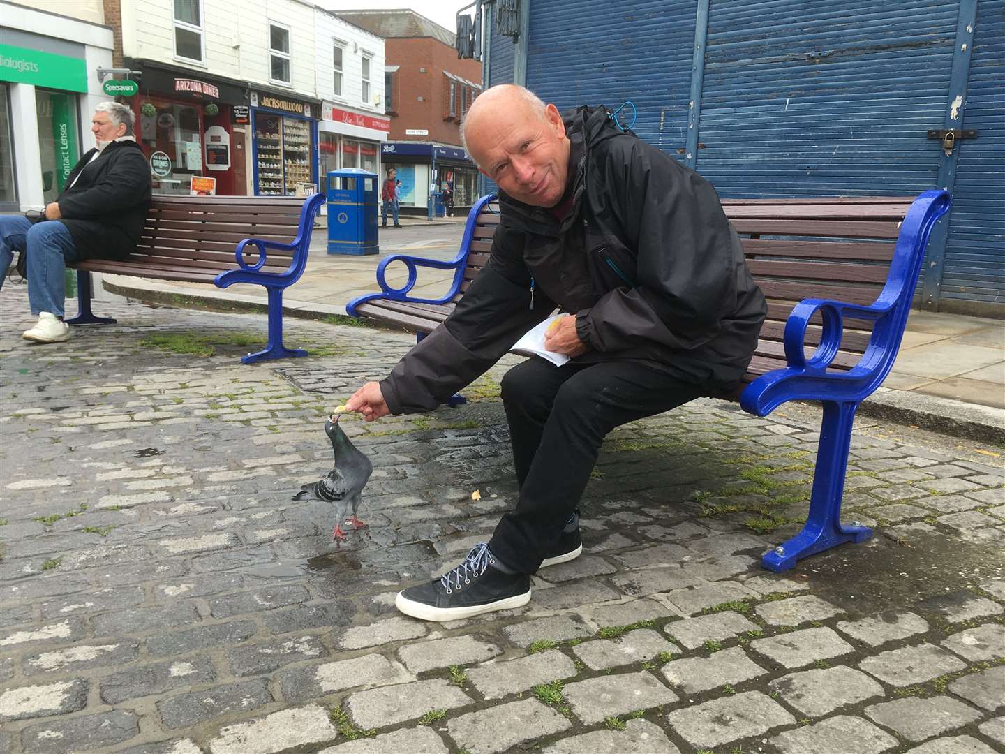 William Wallace, 74, also sometimes feeds the pigeons